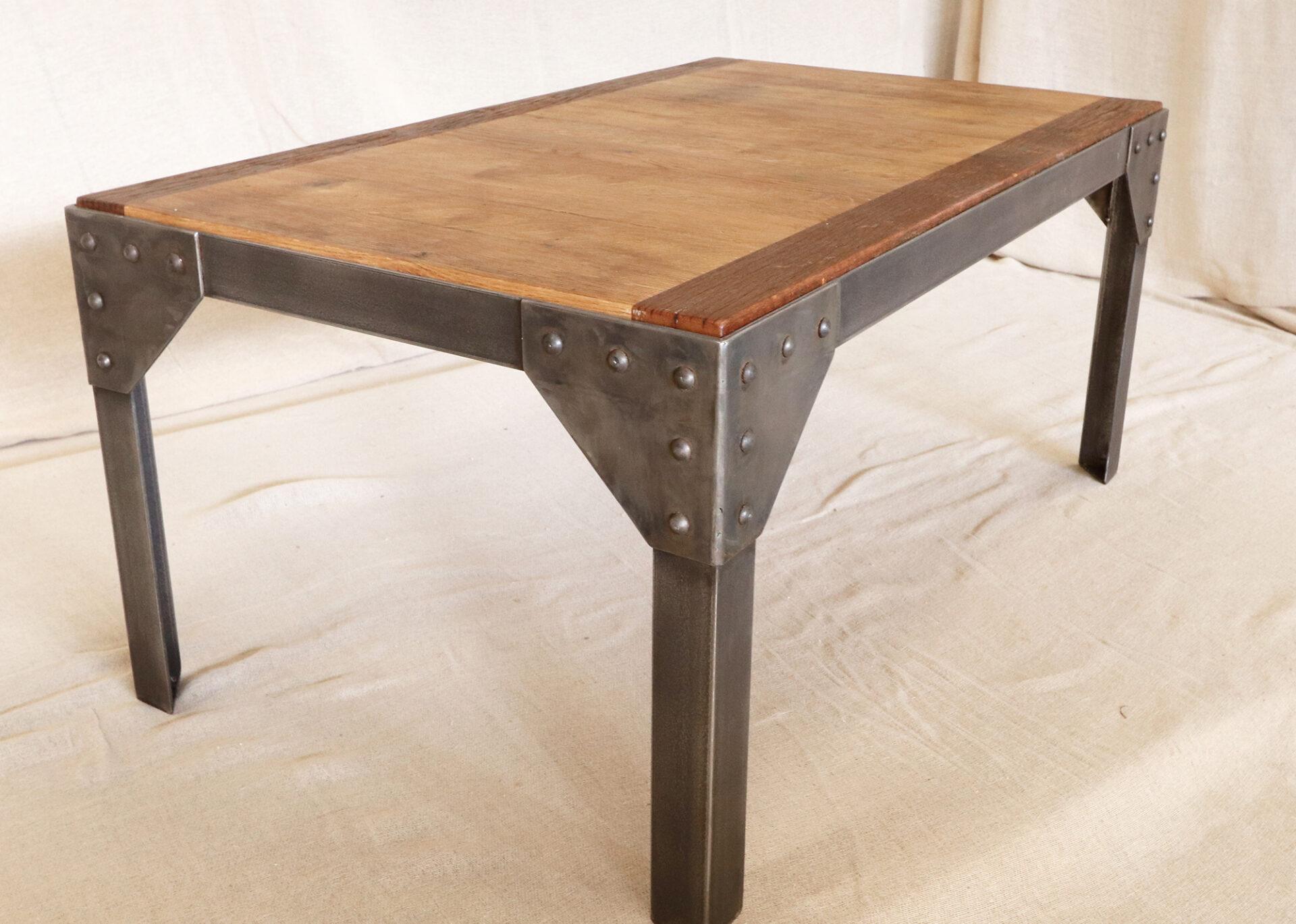 Metal frame coffee table with a reclaimed oak and teak top